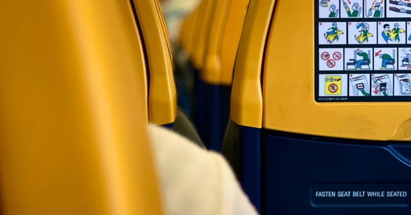 The inside of a Ryanair aeroplane cabin.